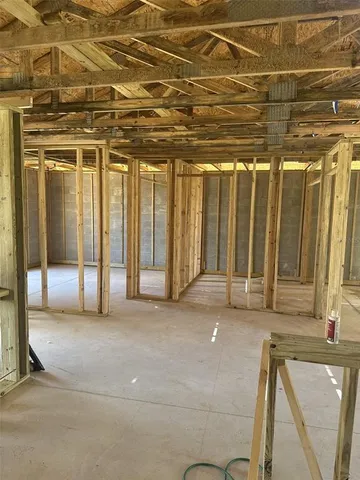 a view of an empty room with a iron stairs