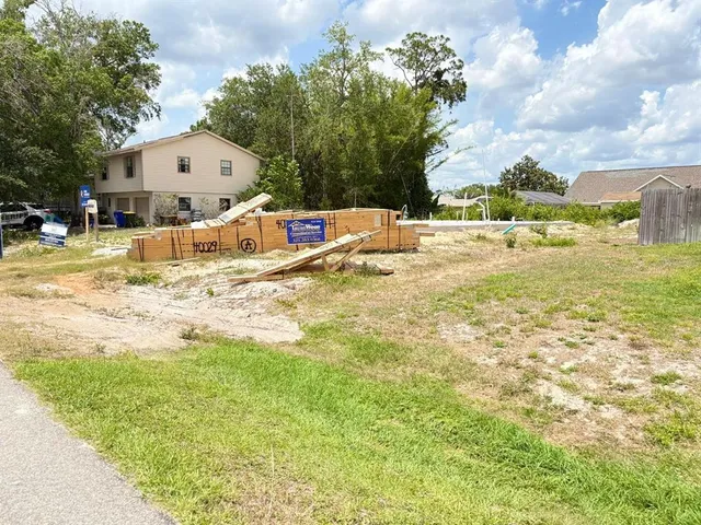 a view of swimming pool with a yard and sitting area