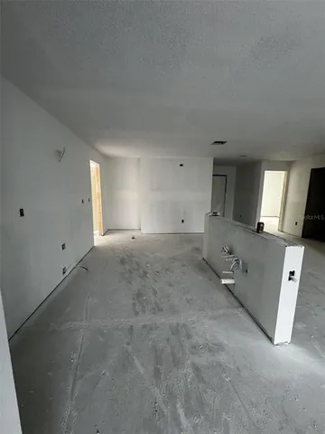 a view of a big room with windows and cabinet