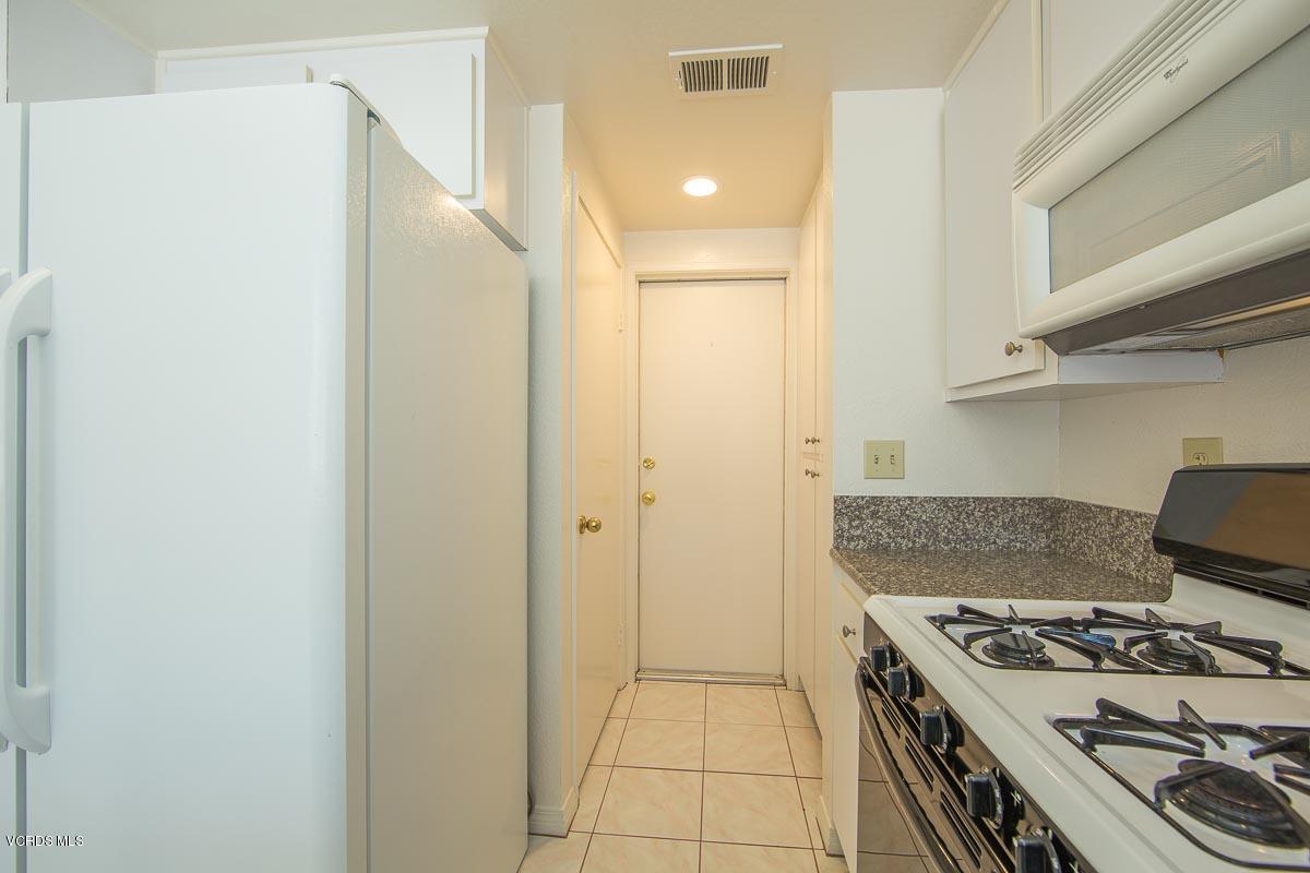 1854 Rory Lane, Unit 3 Simi Valley, CA 93063 - Photo 12 of 29 a kitchen with a stove and a refrigerator