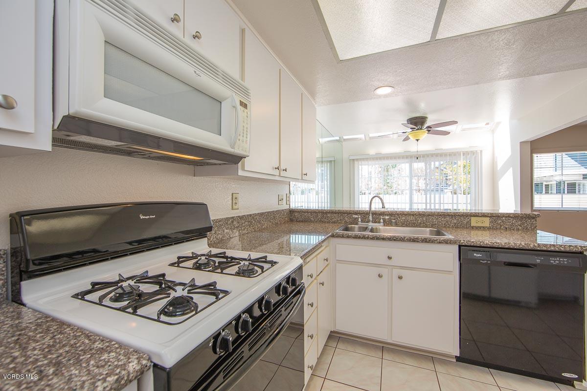 1854 Rory Lane, Unit 3 Simi Valley, CA 93063 - Photo 13 of 29 a kitchen with a stove and a sink