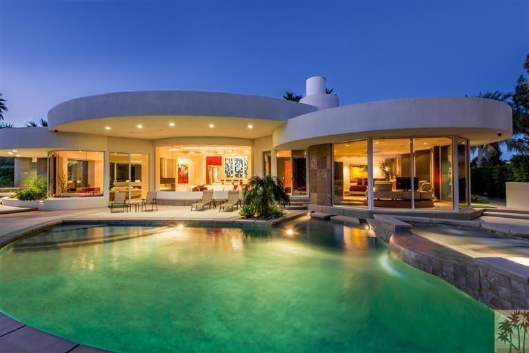 a view of swimming pool with outdoor seating and yard