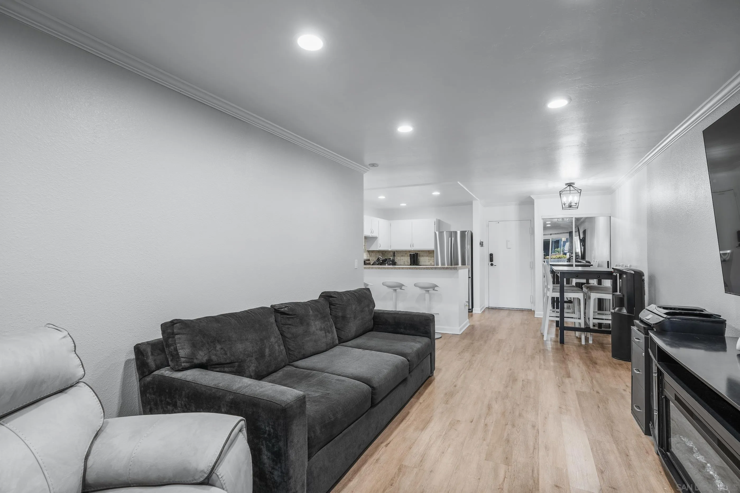 6275 Rancho Mission Road, Unit 105 San Diego, CA 92108 - Photo 11 of 24 a living room with furniture and kitchen view