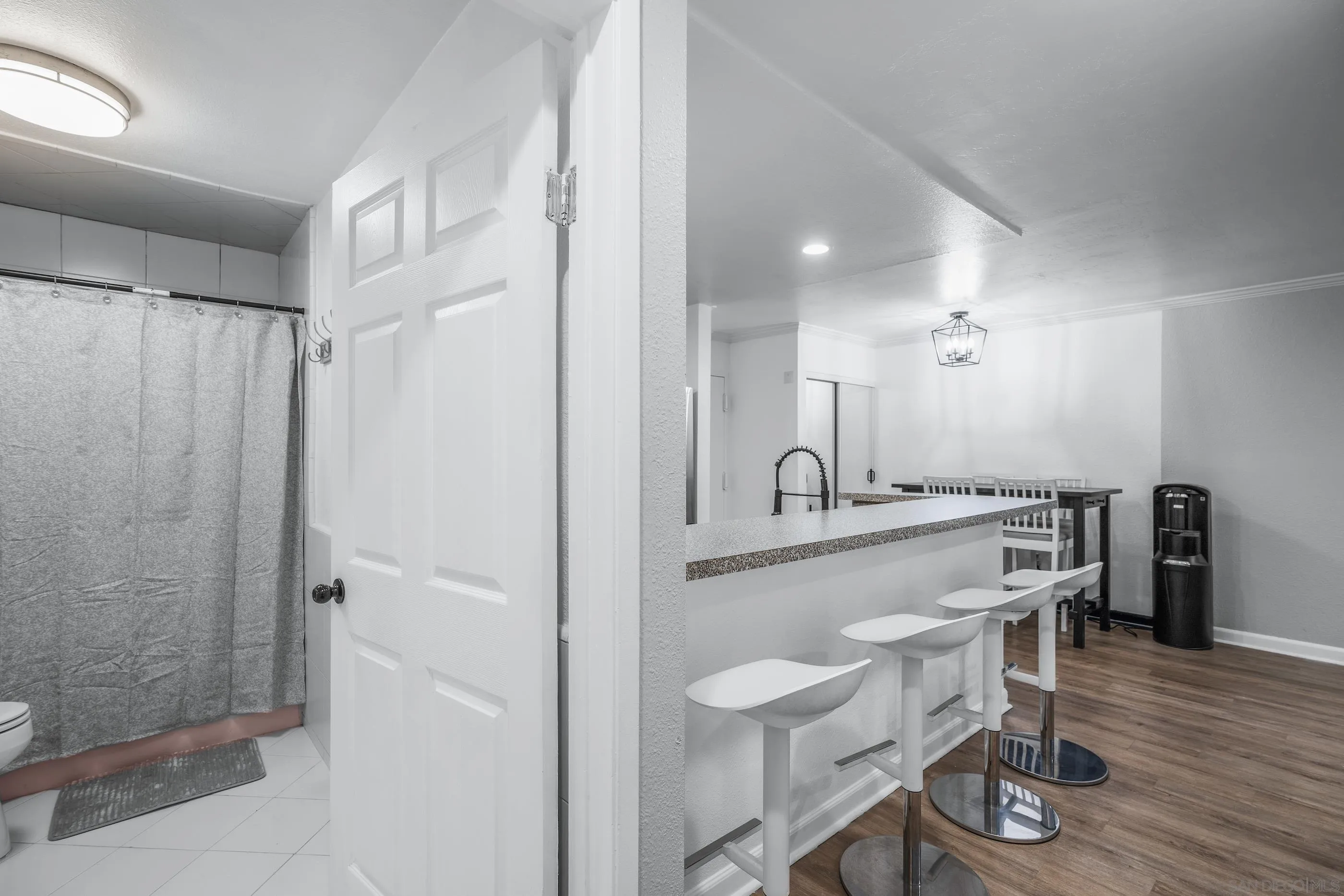 6275 Rancho Mission Road, Unit 105 San Diego, CA 92108 - Photo 17 of 24 a large kitchen with a table and chairs