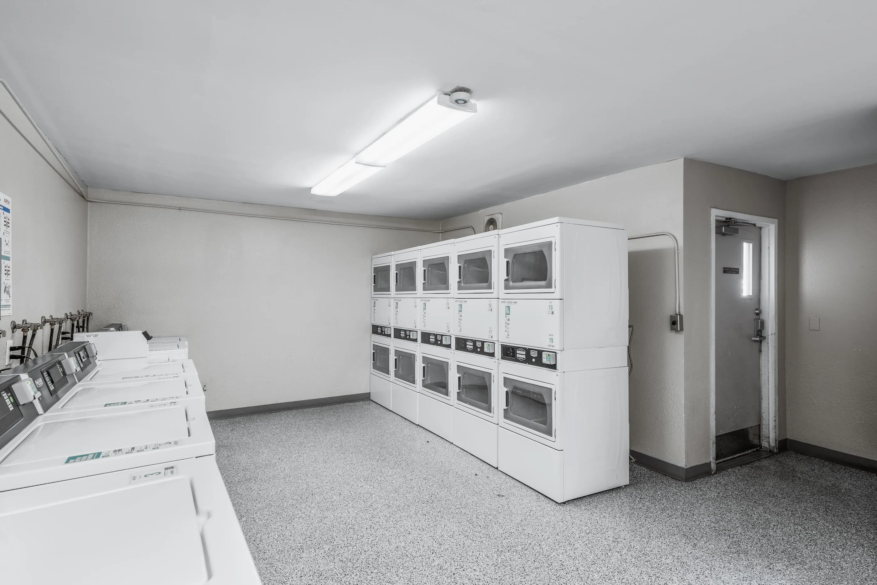 6275 Rancho Mission Road, Unit 105 San Diego, CA 92108 - Photo 23 of 24 a view of an empty room with washer and dryer