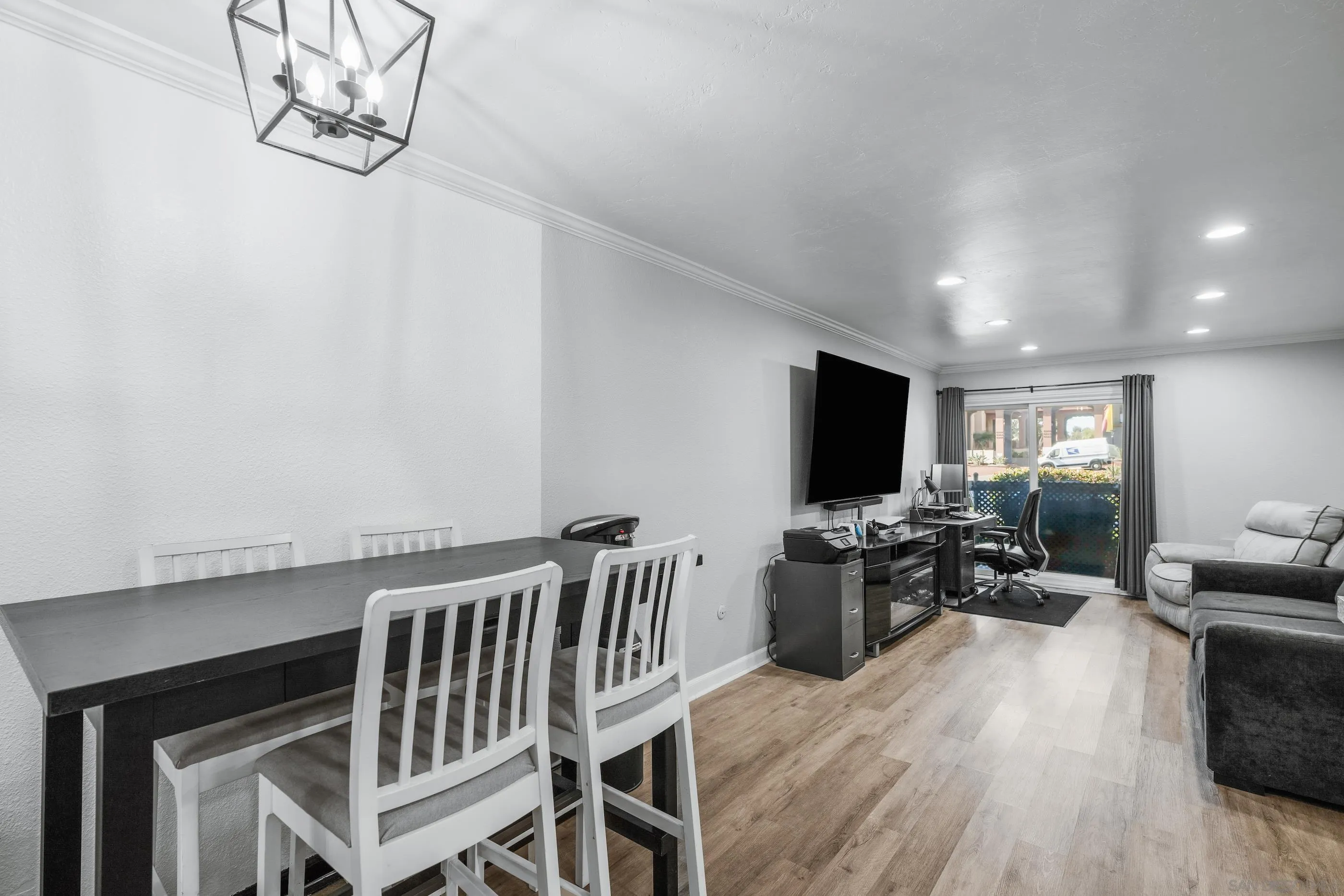 6275 Rancho Mission Road, Unit 105 San Diego, CA 92108 - Photo 3 of 24 a living room with furniture and a flat screen tv