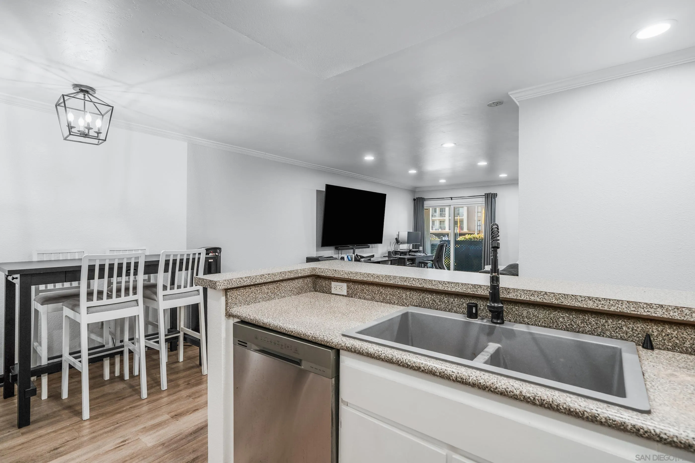 6275 Rancho Mission Road, Unit 105 San Diego, CA 92108 - Photo 7 of 24 a kitchen with a sink and a refrigerator