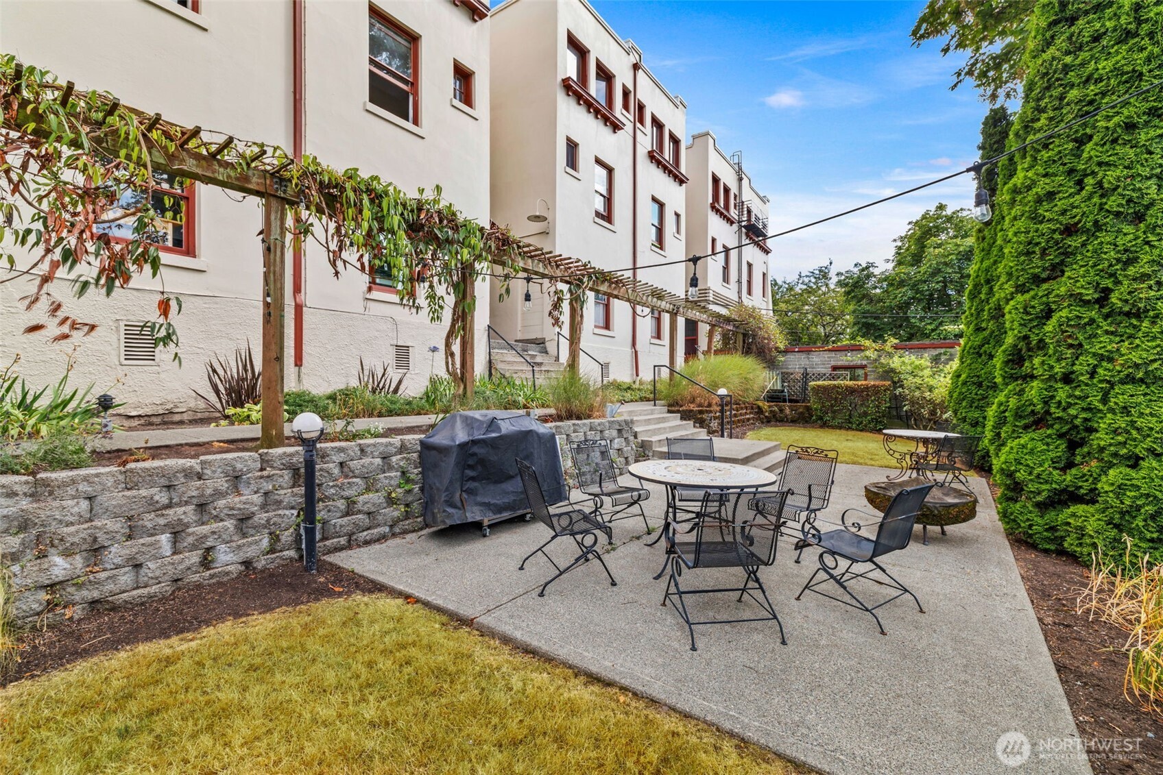 2915 Franklin Avenue East, Unit A Seattle, WA 98102 - Photo 27 of 34 a swimming pool with outdoor seating and yard