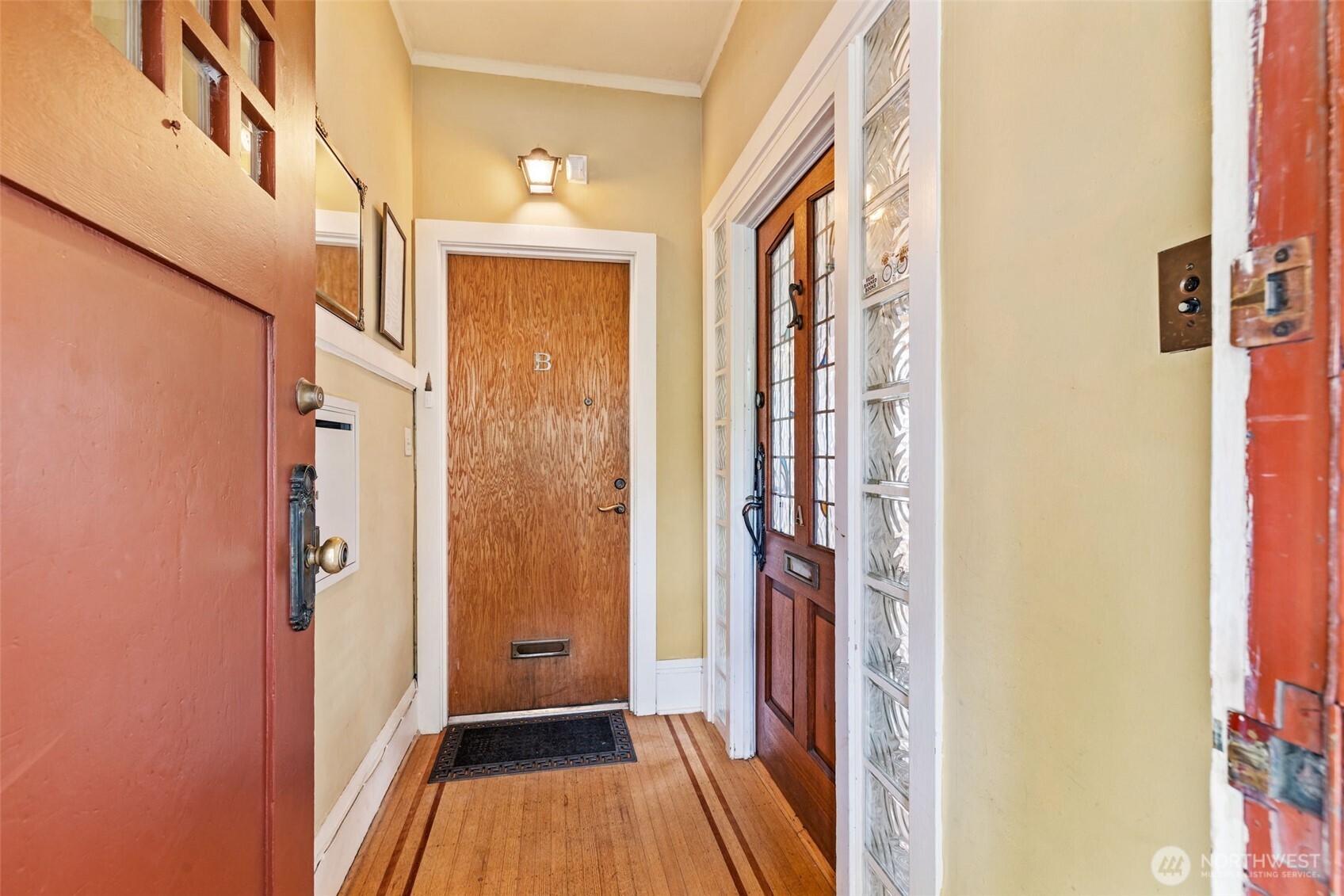 2915 Franklin Avenue East, Unit A Seattle, WA 98102 - Photo 6 of 34 a view of a hallway with wooden floor and staircase