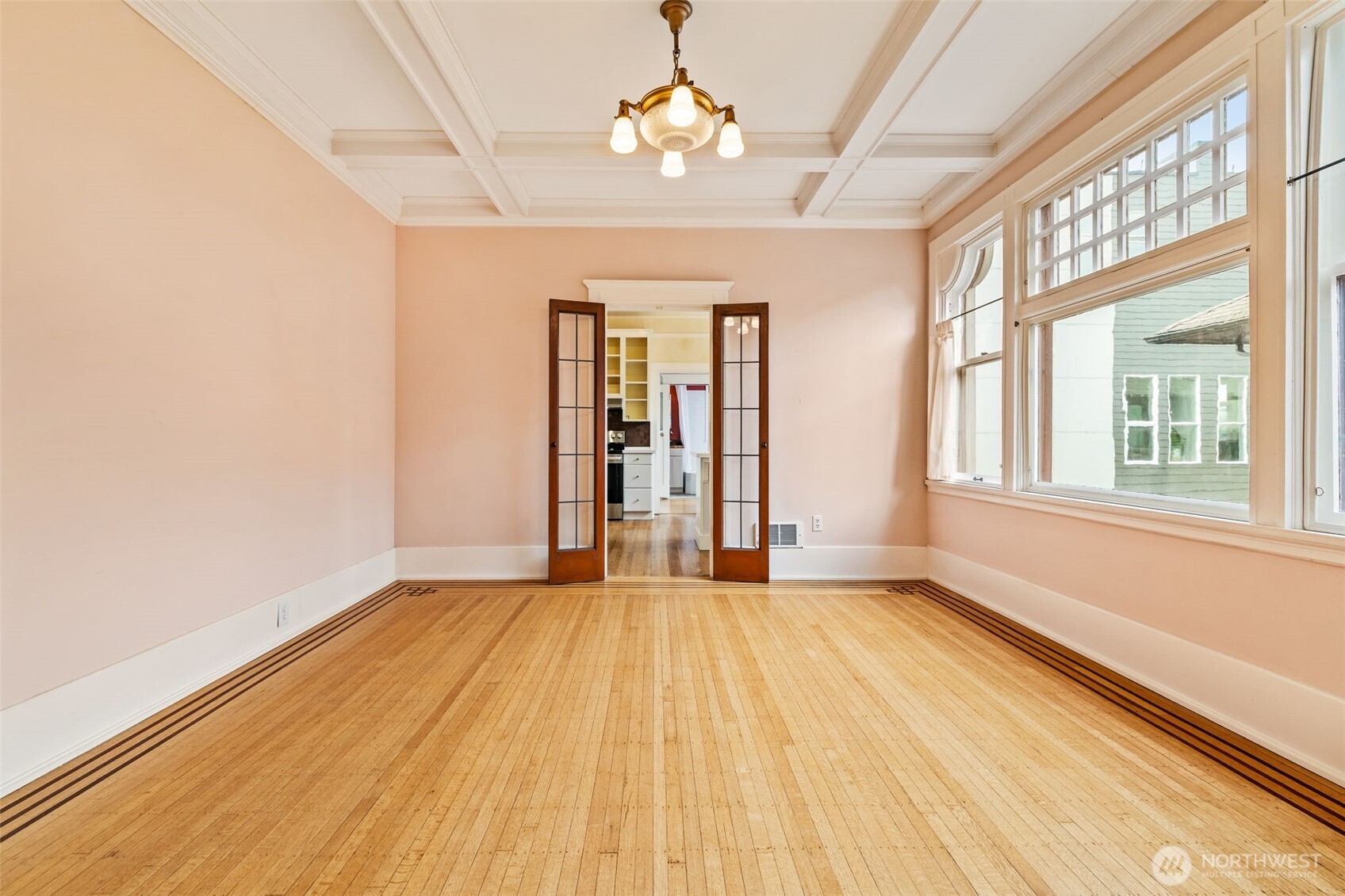 2915 Franklin Avenue East, Unit A Seattle, WA 98102 - Photo 9 of 34 wooden floor in an empty room with a window