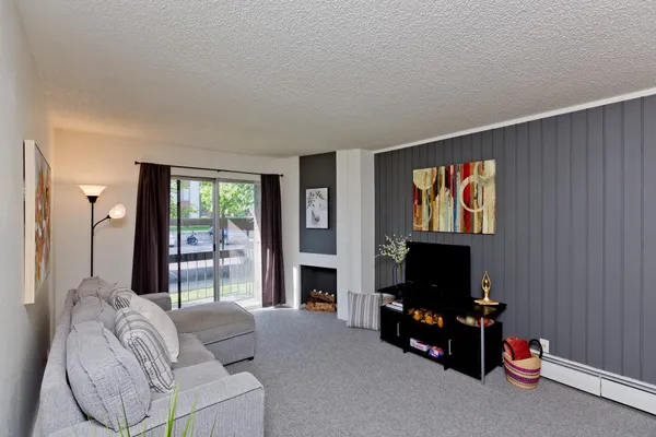 a dining room with furniture and window