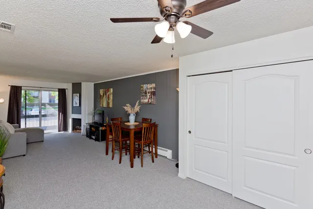 a view of a livingroom with furniture and chandelier