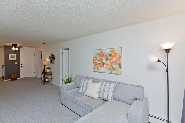 a view of an empty room with a ceiling fan