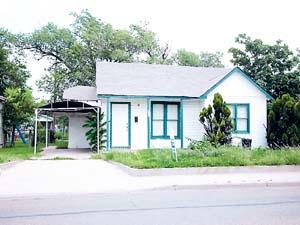 4115 South Washington Street Amarillo, TX 79110 - Photo 1 of 1 a front view of a house with a garden and plants
