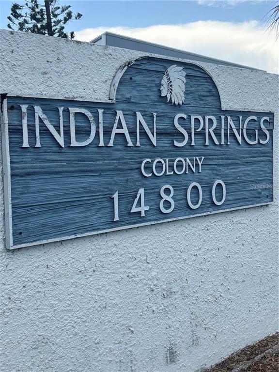 14800 Walsingham Road, Unit 702 Largo, FL 33774 - Photo 4 of 42 a view of a brick wall and a sign