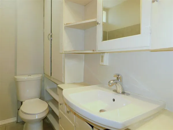 a bathroom with a sink and a toilet