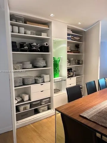 a bathroom with a sink mirror and toilet