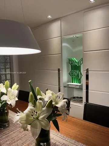 a bathroom with a sink mirror and vanity