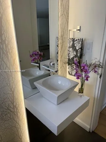 a bathroom with a sink and a mirror