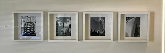 a view of kitchen with furniture and electronic appliances