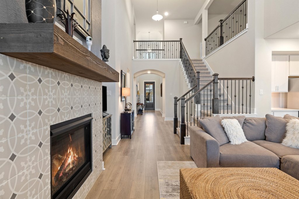 a living room with furniture and a fireplace