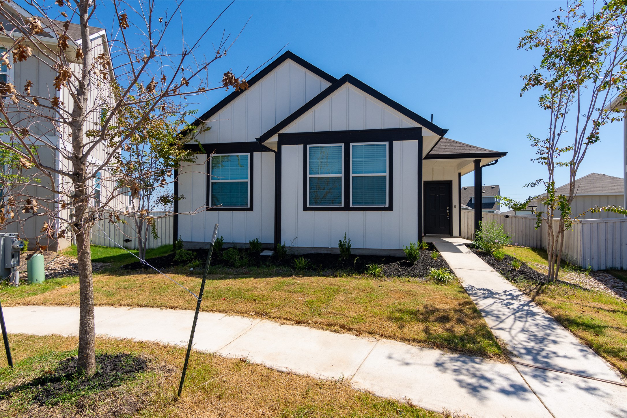 350 Fabion Street Kyle, TX 78640 - Photo 1 of 33 a front view of a house with a yard