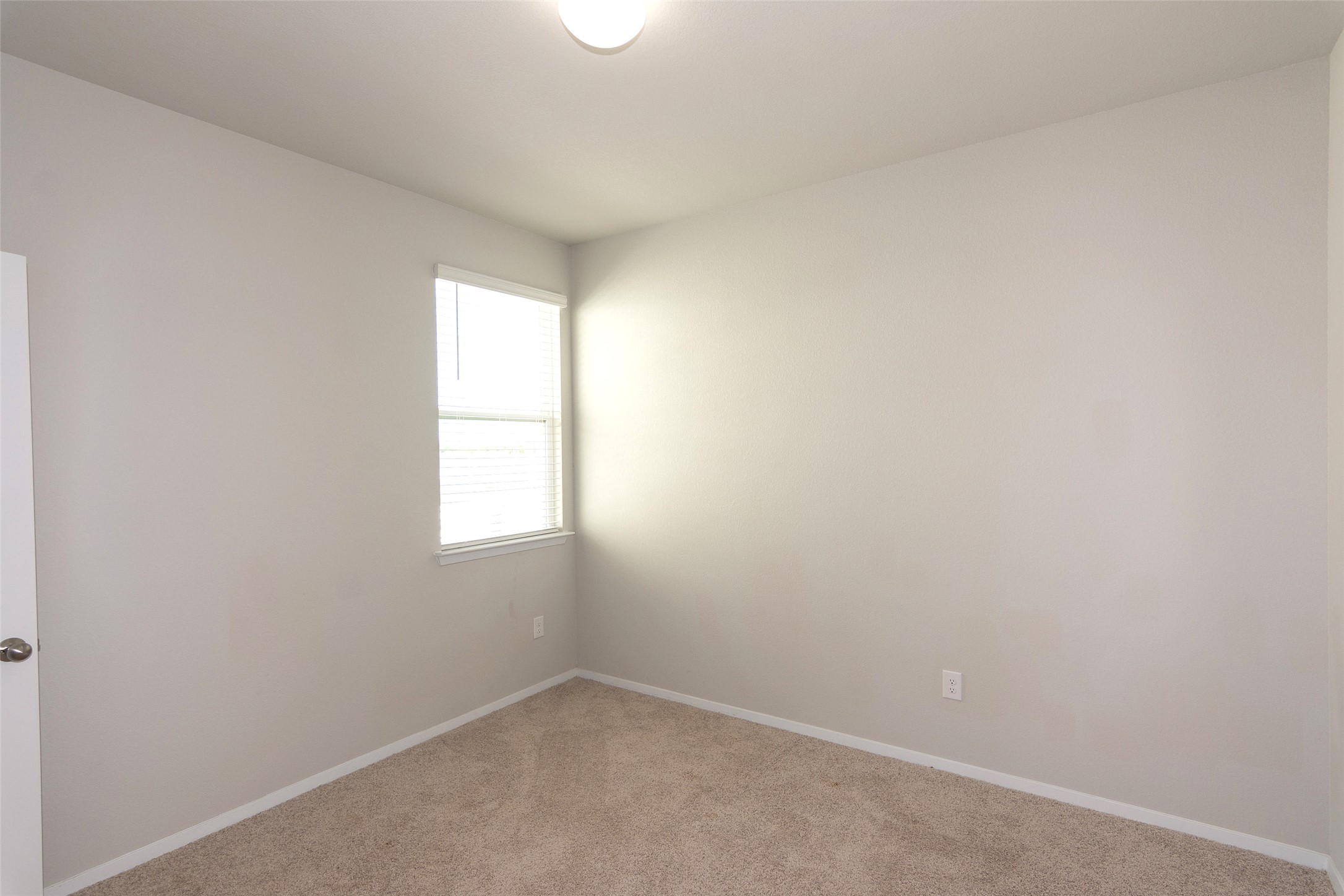 350 Fabion Street Kyle, TX 78640 - Photo 17 of 33 an empty room with a window