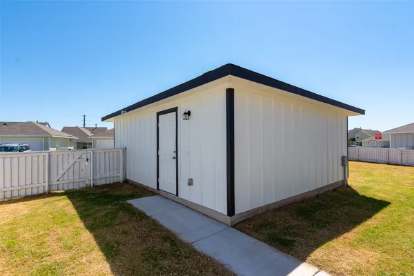 a view of a backyard with cabin