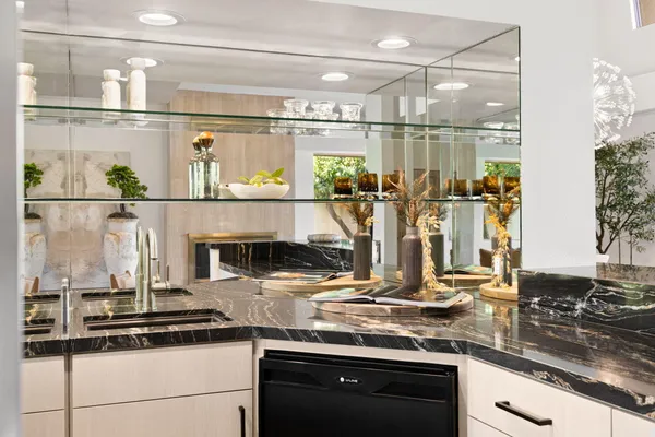 a kitchen with kitchen island granite countertop stainless steel appliances and counter space