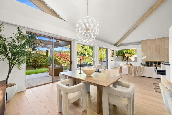 a very nice looking living room with a large window and a table