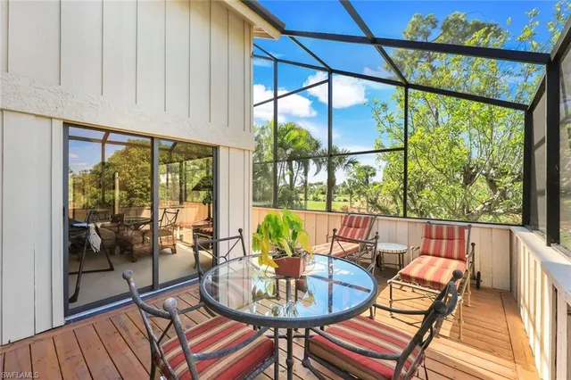a view of a dining room with furniture wooden floor and a potted plant