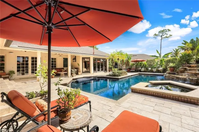 a view of a swimming pool with a patio