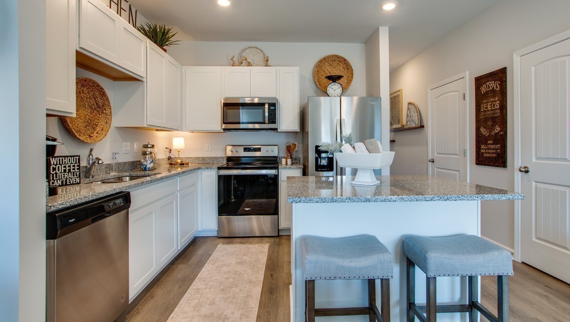 130 Cecil Road Lebanon, TN 37087 - Photo 11 of 46 a kitchen with stainless steel appliances a sink cabinets and wooden floor