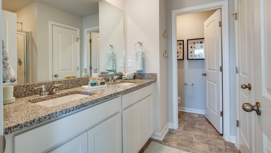 130 Cecil Road Lebanon, TN 37087 - Photo 19 of 46 a bathroom with a granite countertop double vanity sink and a mirror