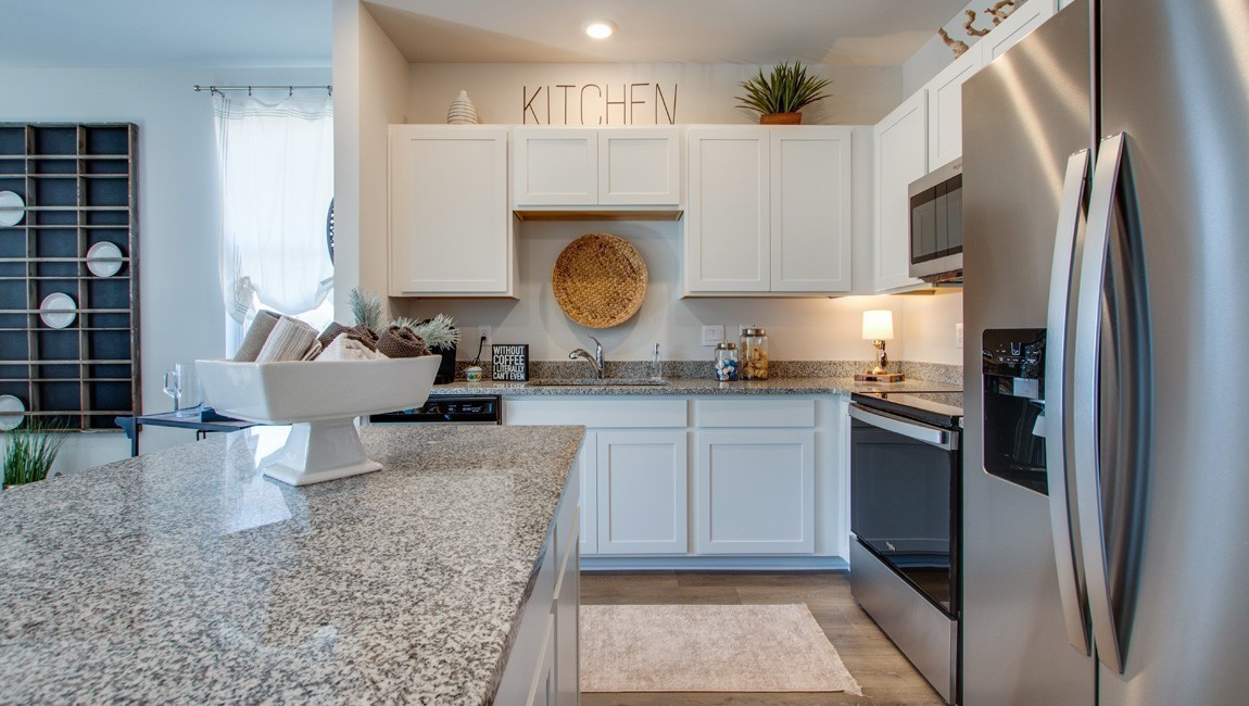 130 Cecil Road Lebanon, TN 37087 - Photo 10 of 46 a kitchen with granite countertop a refrigerator a stove and a sink
