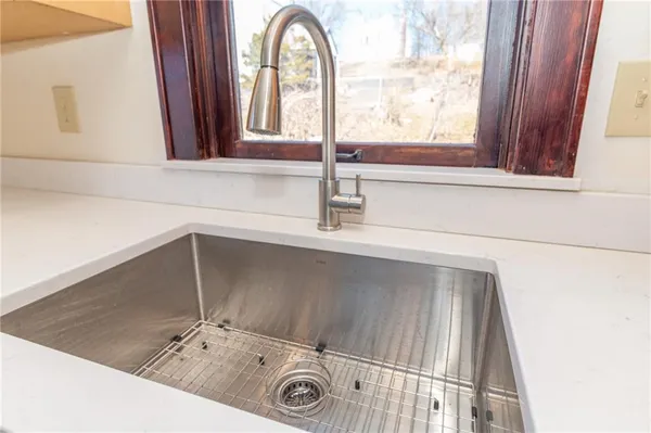 a bathroom with a sink and a window