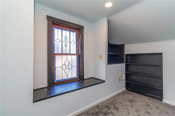 a view of an empty room and window