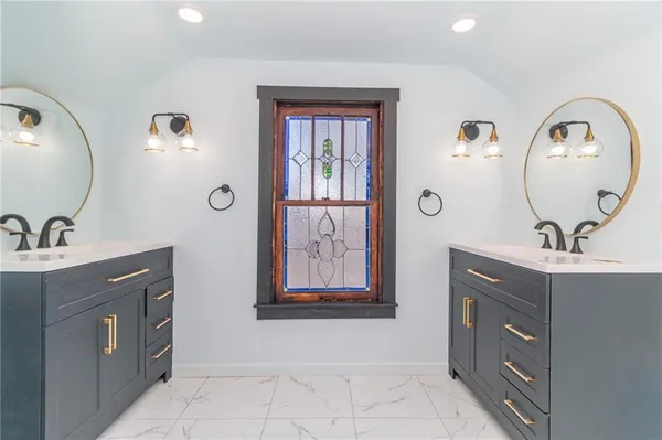 a bathroom with a sink and a mirror