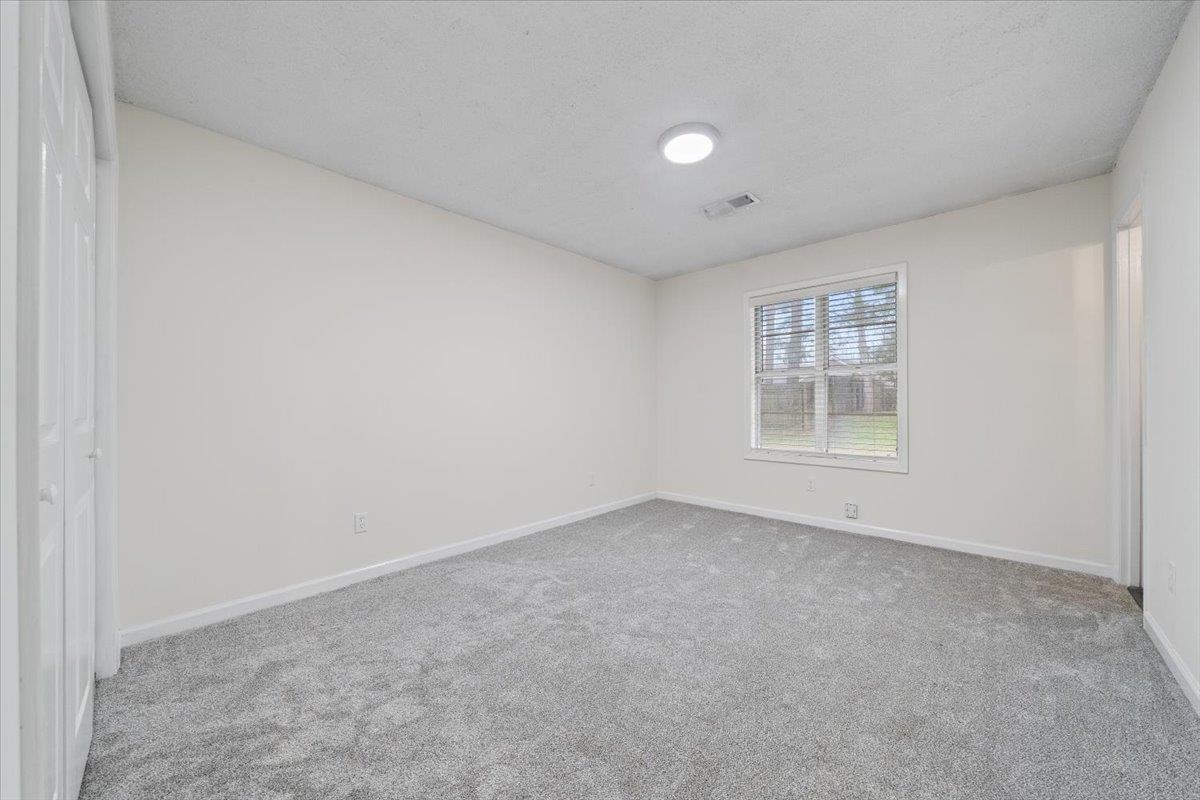 947 Hunters Retreat Drive Collierville, TN 38017 - Photo 12 of 24 an empty room with windows