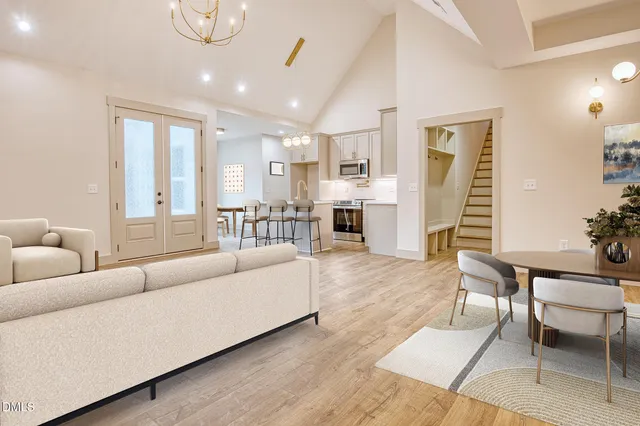 a living room with furniture and a table