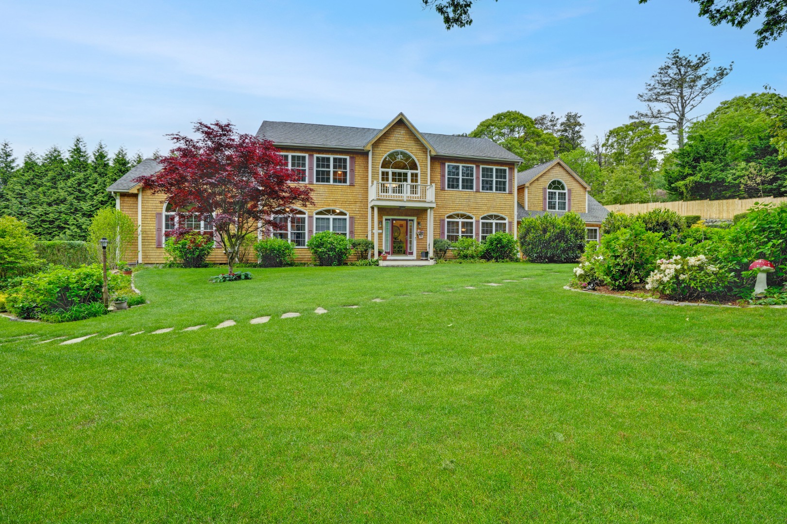 8 Fresh Pond Road Oak Bluffs, MA 02557 - Photo 1 of 36 a front view of a house with a garden