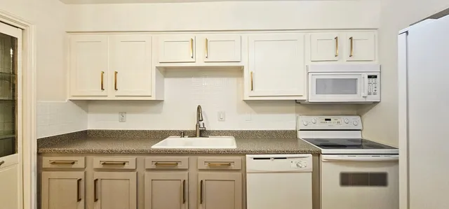 a view of a table and chairs in the kitchen