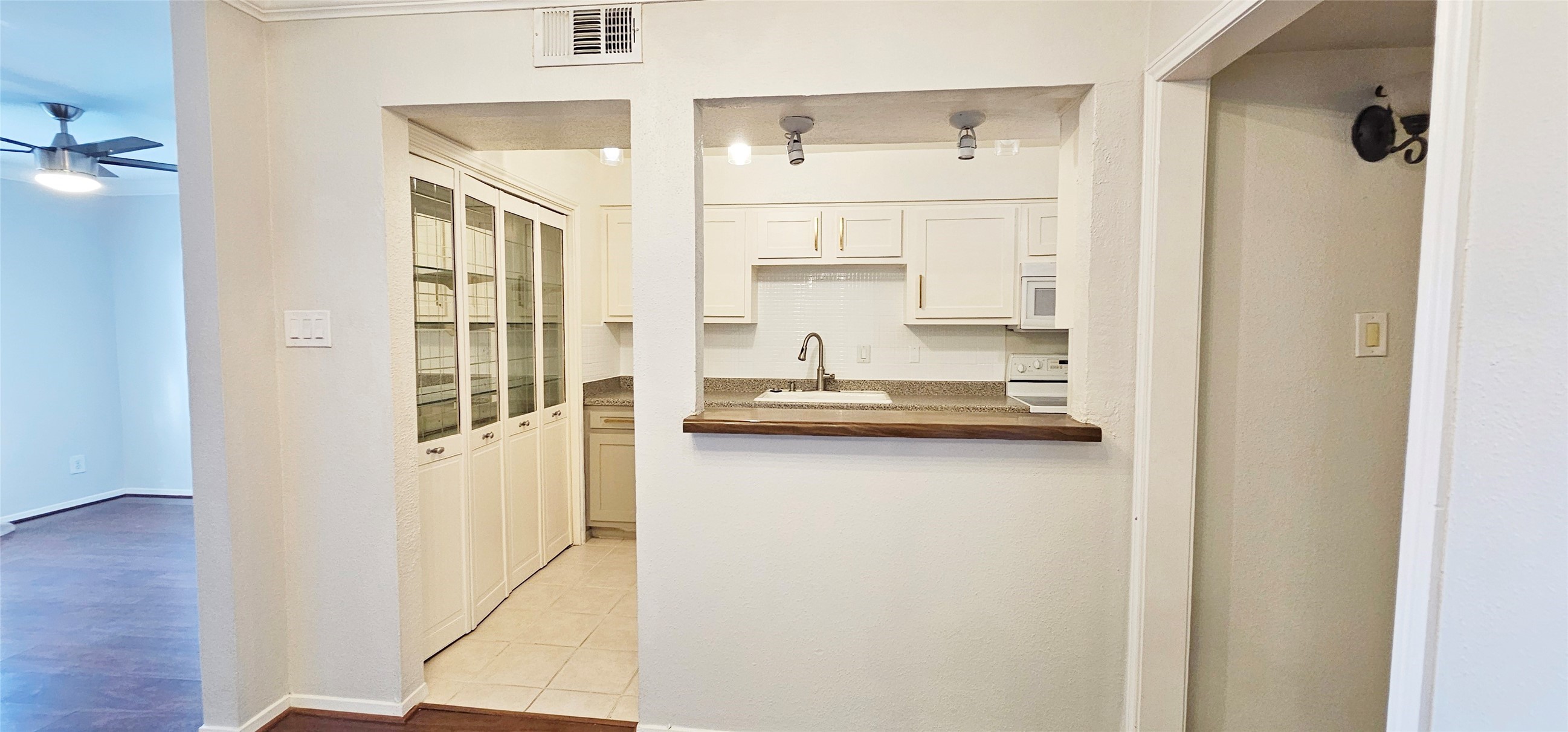 11550 Chimney Rock Road, Unit 205 Houston, TX 77035 - Photo 10 of 27 a kitchen with a refrigerator a sink and cabinets