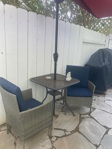 a view of a livingroom with furniture and wooden floor