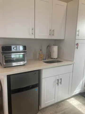 a kitchen with a stove and cabinets