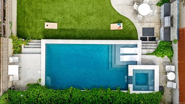 a view of a house with a small yard