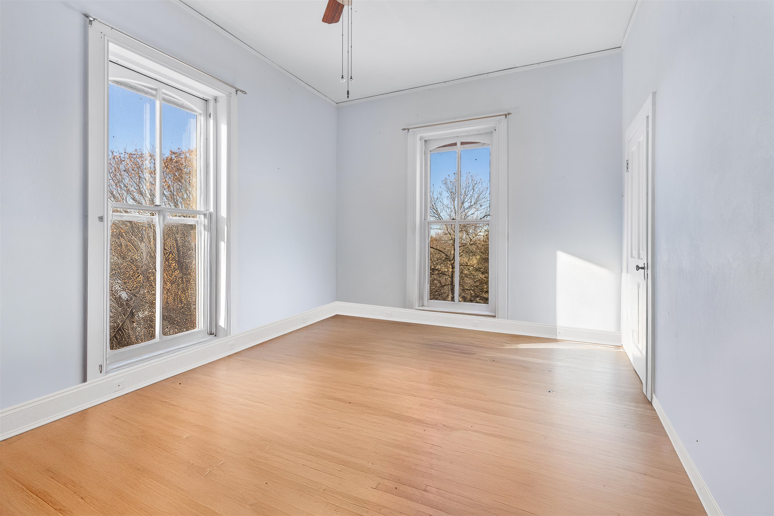 395 North Cedarville Road Freeport, IL 61032 - Photo 14 of 47 a view of an empty room with a window and wooden floor