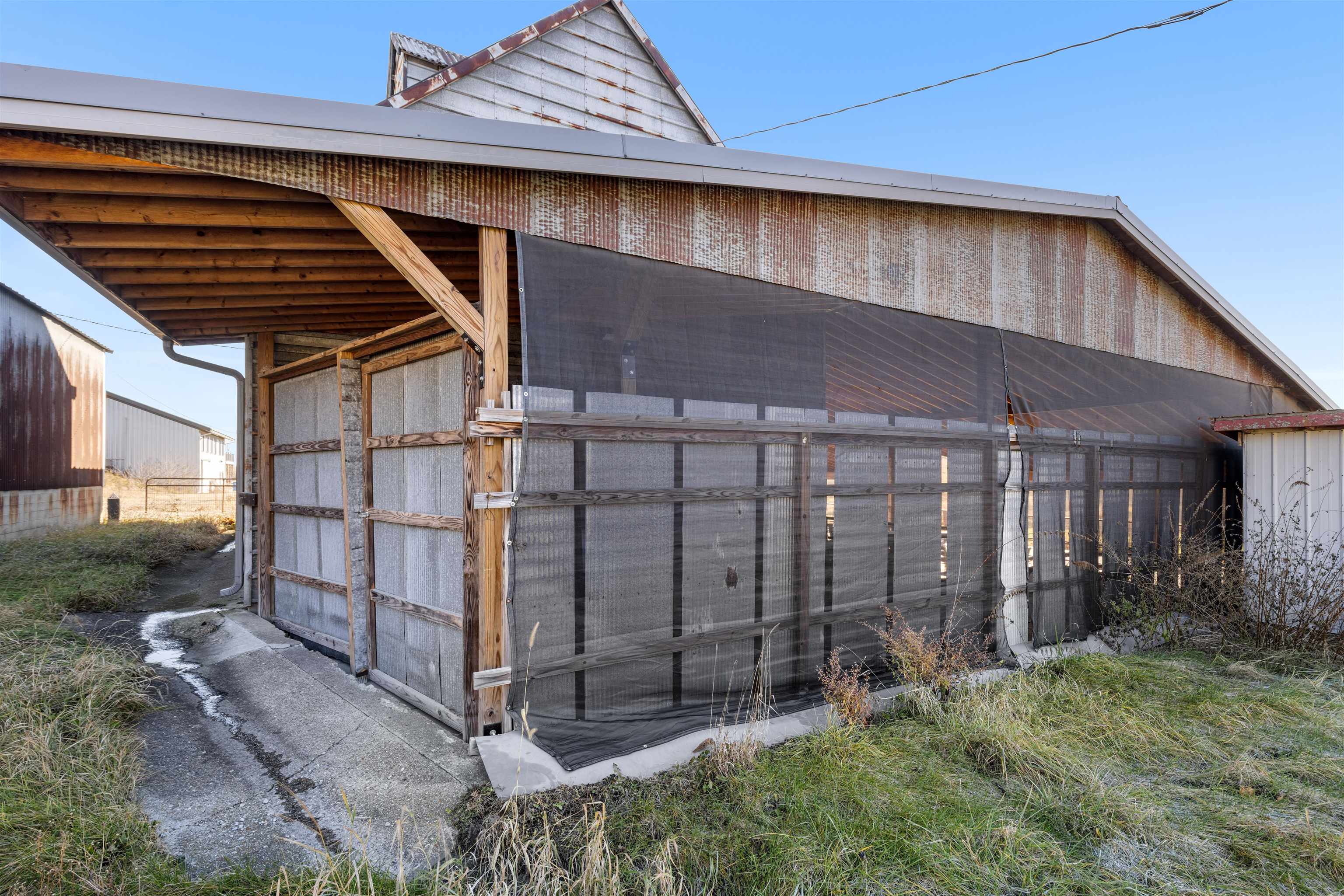 395 North Cedarville Road Freeport, IL 61032 - Photo 31 of 47 a backyard of a house with lots of green space