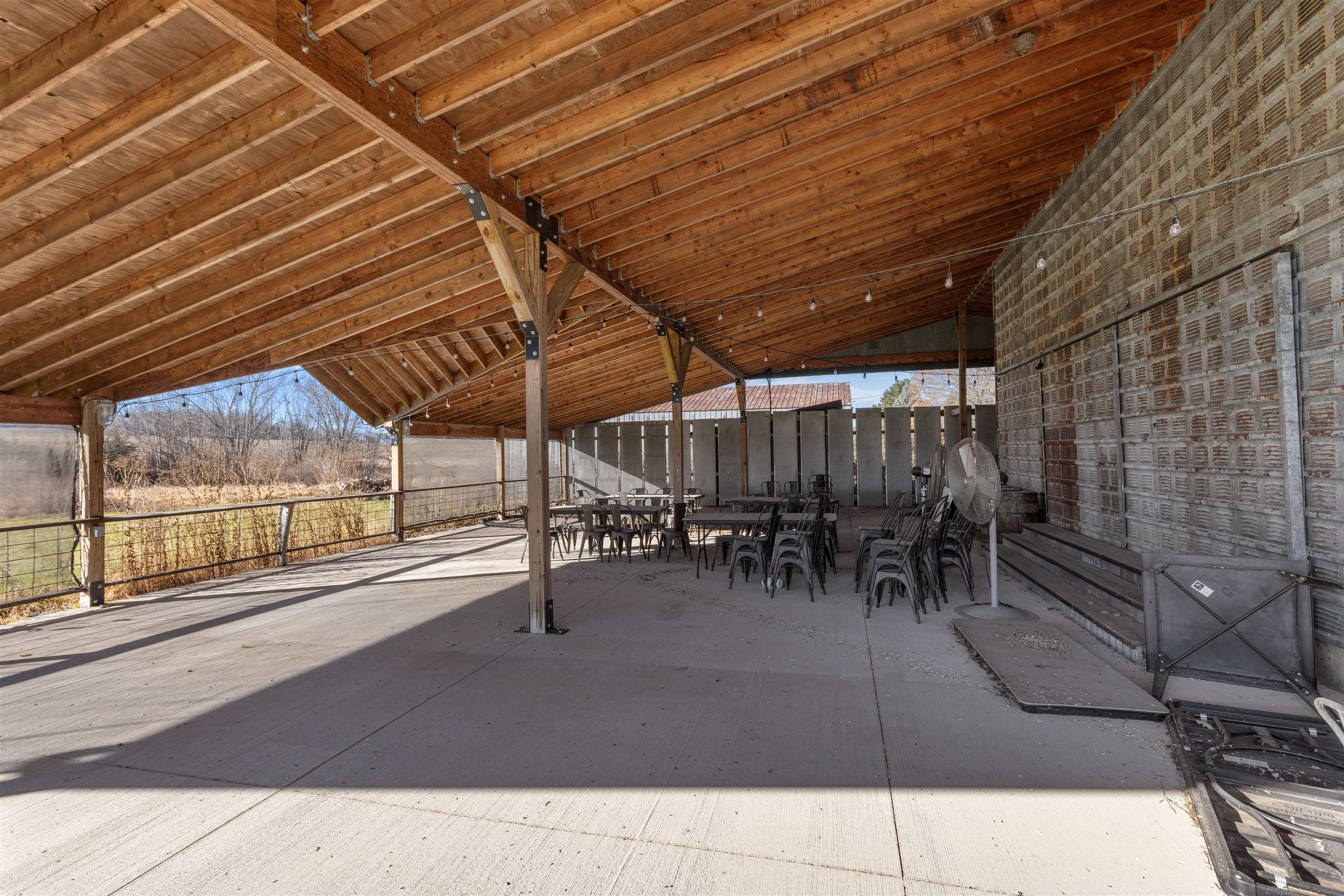 395 North Cedarville Road Freeport, IL 61032 - Photo 32 of 47 a view of a patio with table and chairs and potted plants
