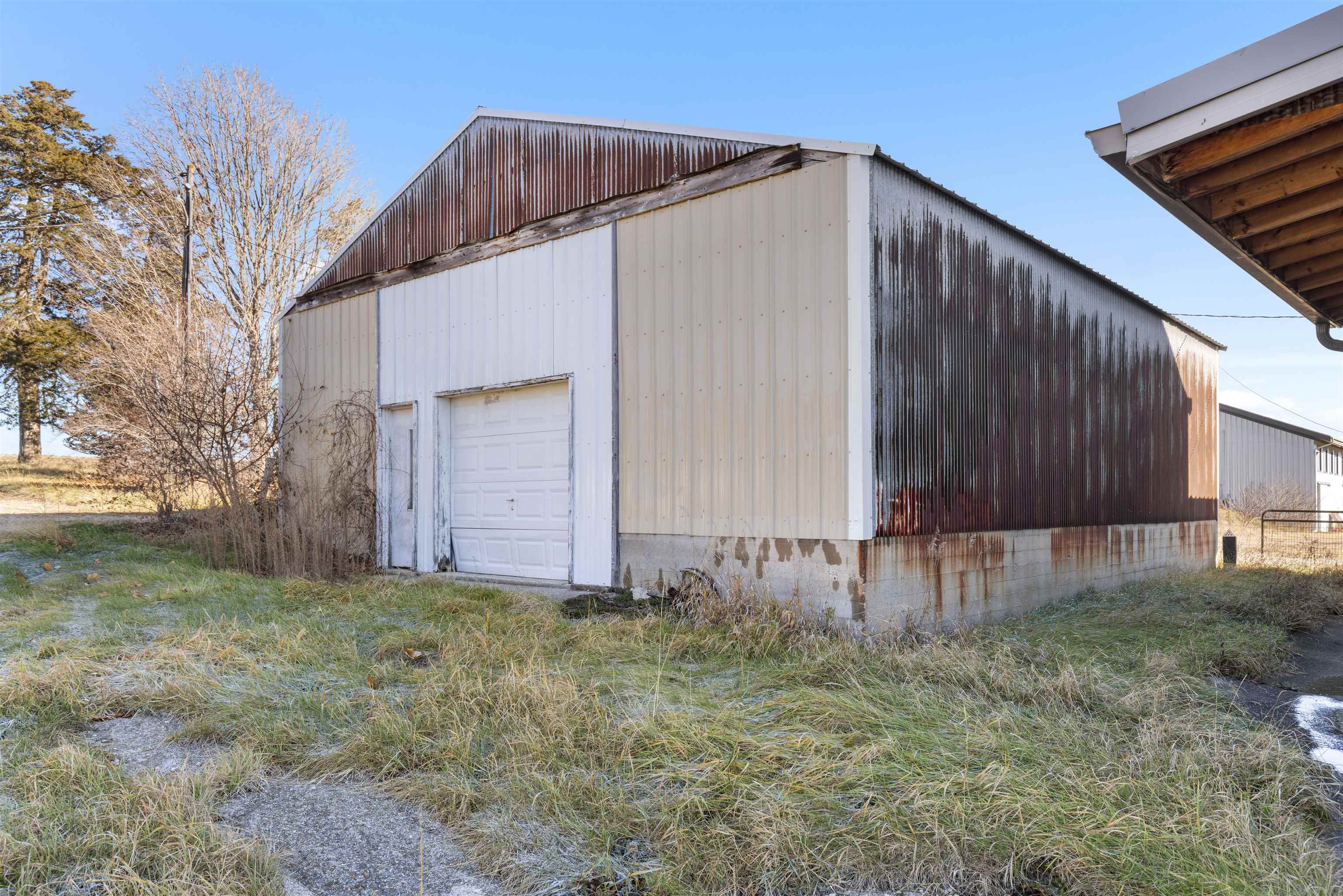 395 North Cedarville Road Freeport, IL 61032 - Photo 36 of 47 a view of a house with backyard and trees